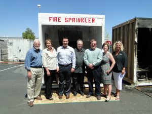 HFSC founding members with spokesperson Ron Hazelton after a fire sprinkler demo at the NFPA convention in Las Vegas. (Left to right) Ron Hazelton, Home Improvement Editor; Peg Paul, HFSC Communications Manager; Frank Mortl AFSA; Steve Muncy AFSA; Gary Keith, FM Global; Lorraine Carli, NFPA; and Vickie Pritchett, NFSA. 